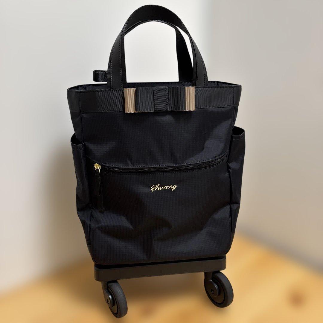 値下げ‼️人気ブランド‼️SWANY‼️スワニー4輪キャリーバック（レインカバー付き）