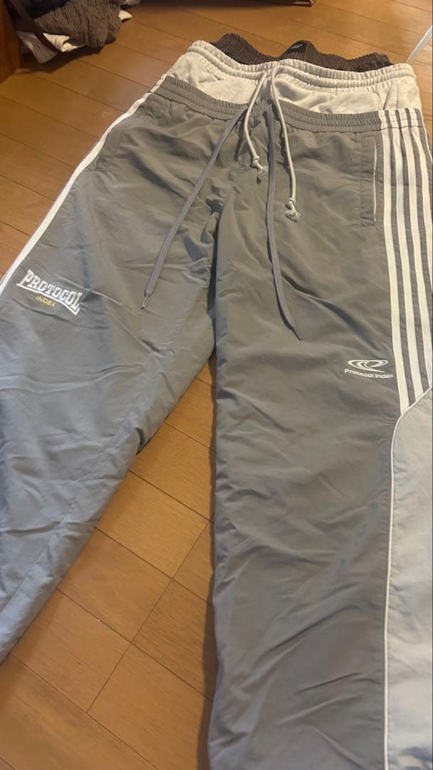 パンツ Protocol Index 3 LAYERED TRACK PANTS GRY