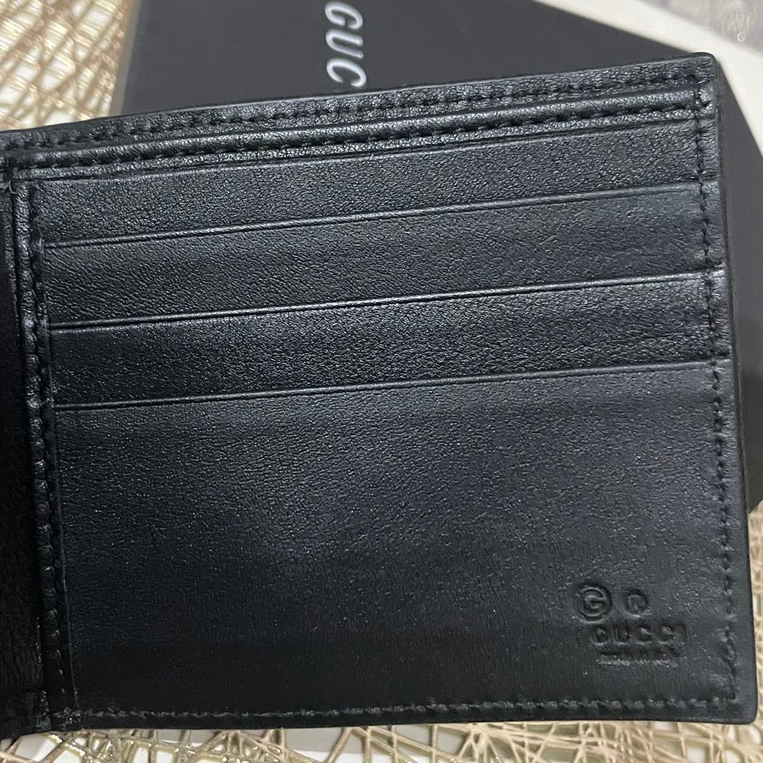① GUCCI メンズ　スモールGGエンボス　お札とカード専用財布　ブラック