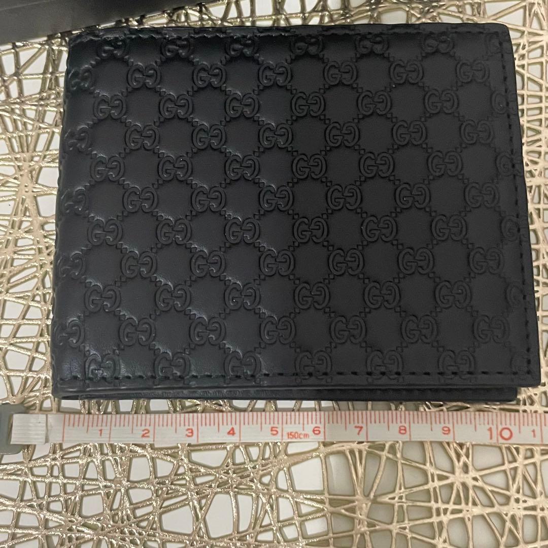 ① GUCCI メンズ　スモールGGエンボス　お札とカード専用財布　ブラック