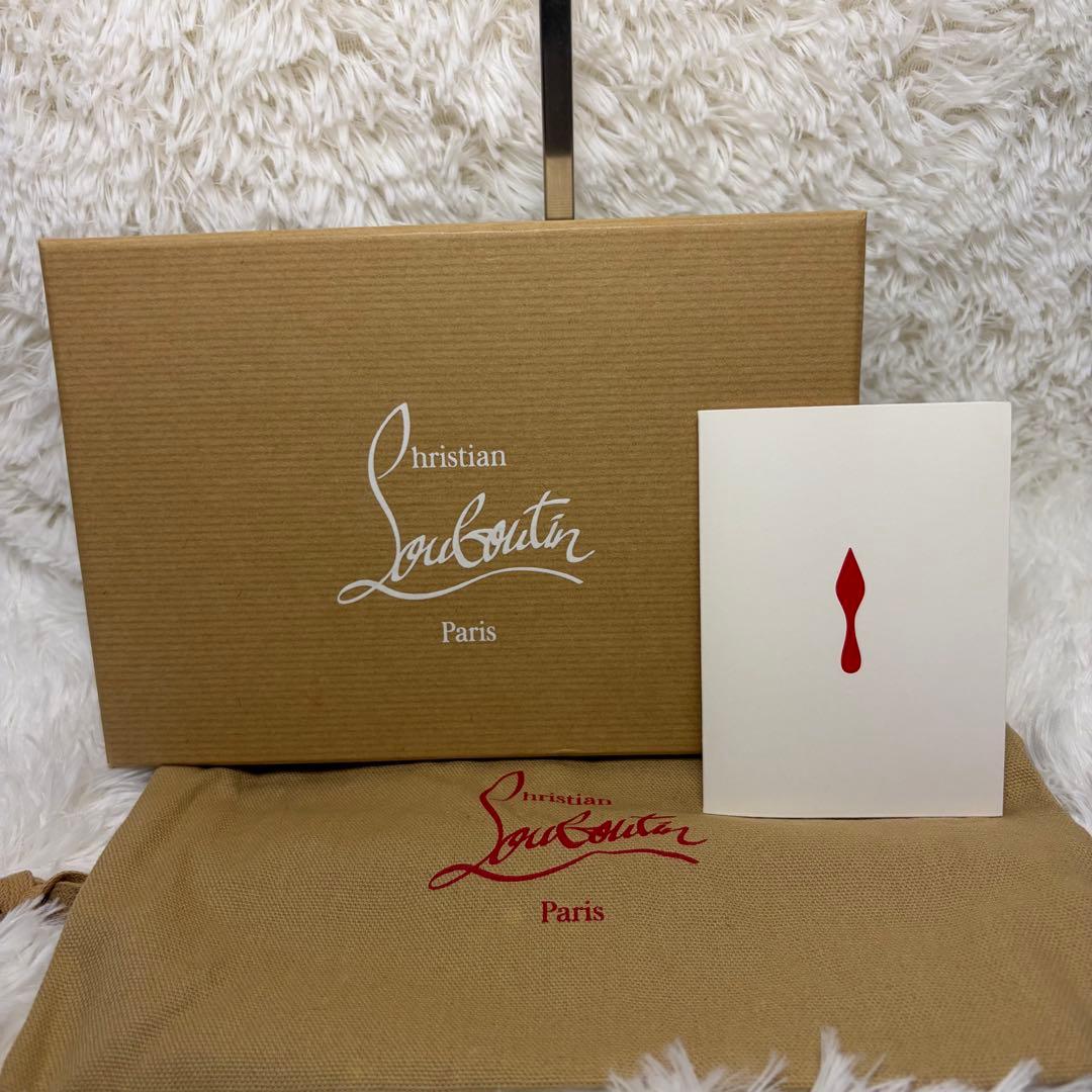 クリスチャンルブタンパネトーネ グラデーションスタッズ ラウンドジップ長財布