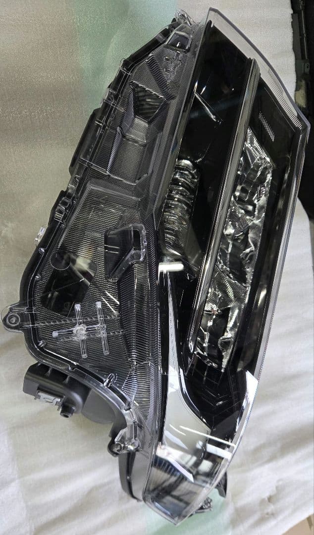 ダイハツ　ムーヴ　ヘッドライト　左