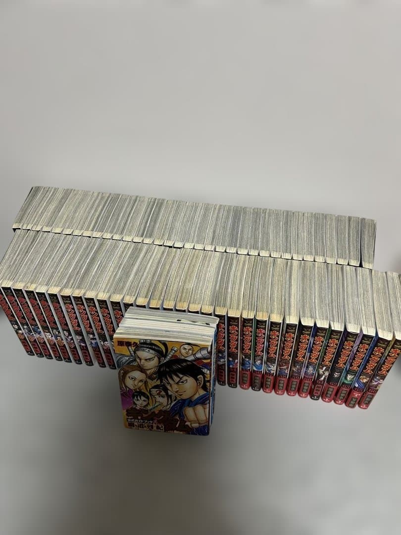 キングダム 1巻〜67巻、※64巻のみ無し。(公式ガイドブック、問題集付き)