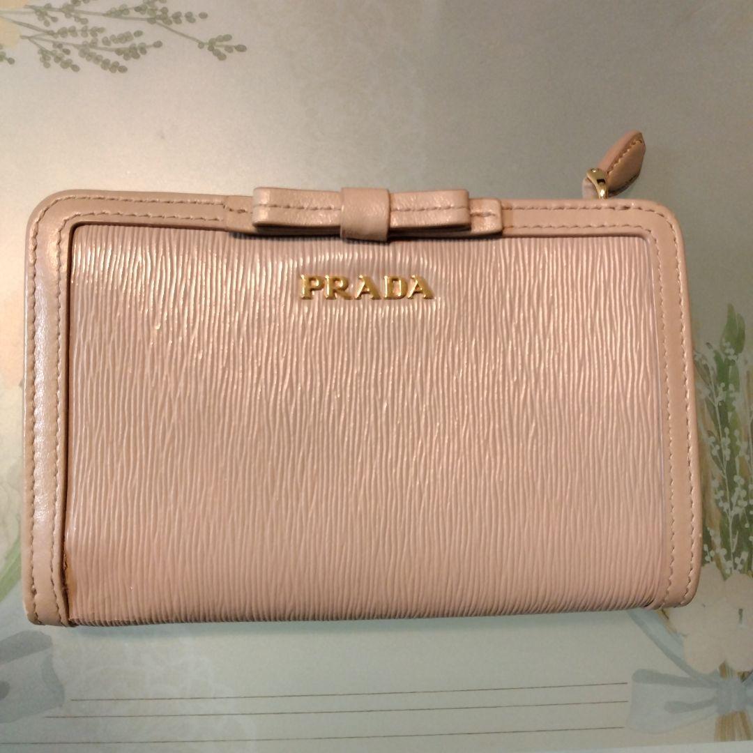 PRADA 二つ折り財布 リボン　ピンクベージュ