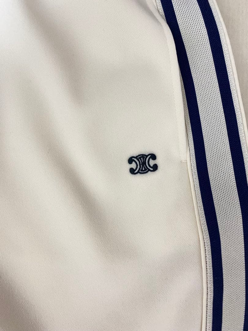 ExxxxxZCELINEサイドライントリオンフフレアトラックロングパンツ