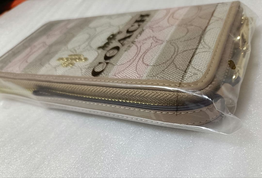 COACH ストライプ長財布 ベージュ ピンク