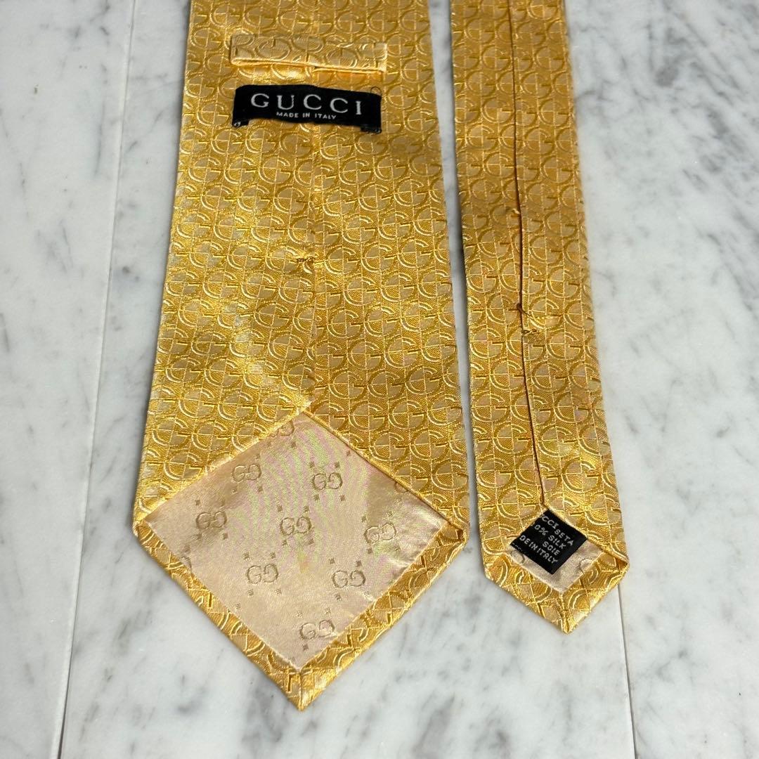 GUCCI ネクタイ Gロゴ柄 光沢 ゴールド パターン柄
