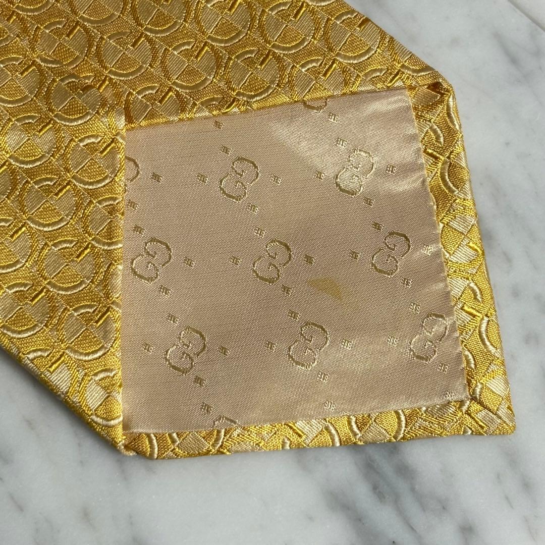 GUCCI ネクタイ Gロゴ柄 光沢 ゴールド パターン柄