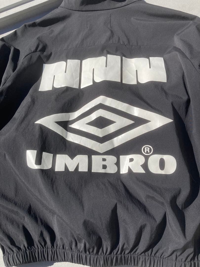 NBB WEEKEND × UMBROハーフジップ ピステ ジャケット