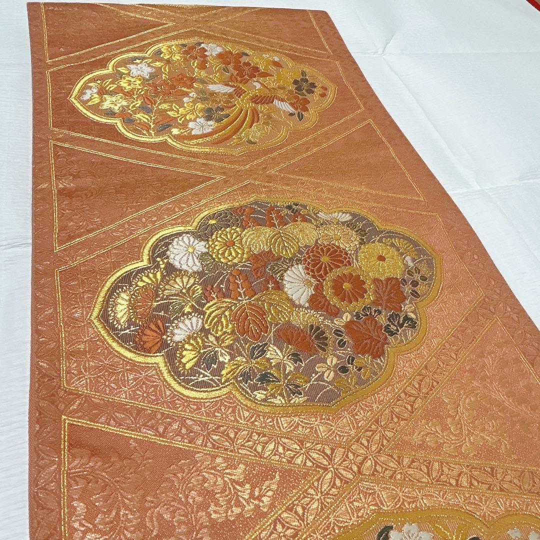 梅垣織物　袋帯　西陣織　七宝菱蒔絵文　正絹　金糸　オレンジゴールド系　逸品