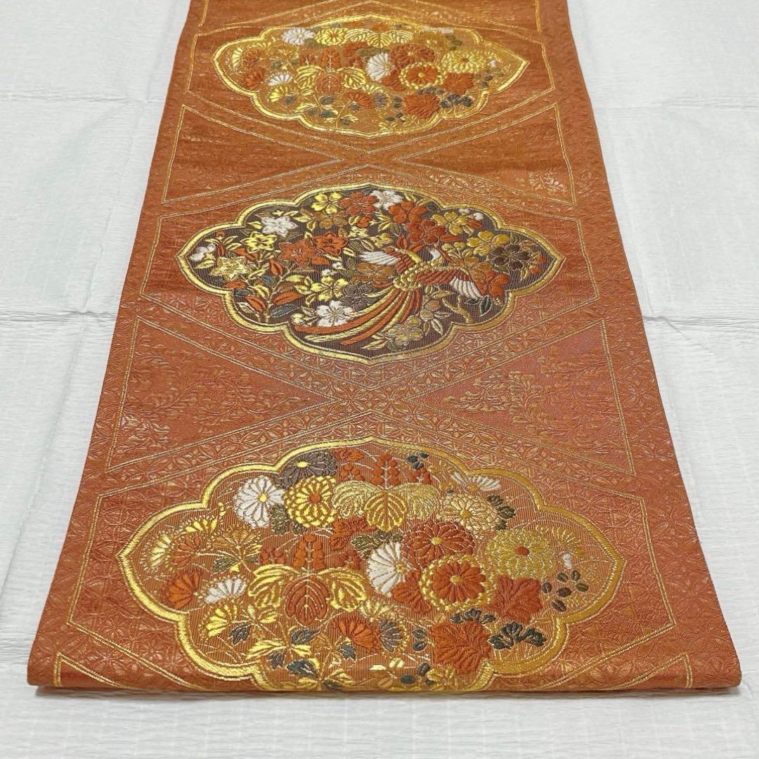 梅垣織物　袋帯　西陣織　七宝菱蒔絵文　正絹　金糸　オレンジゴールド系　逸品