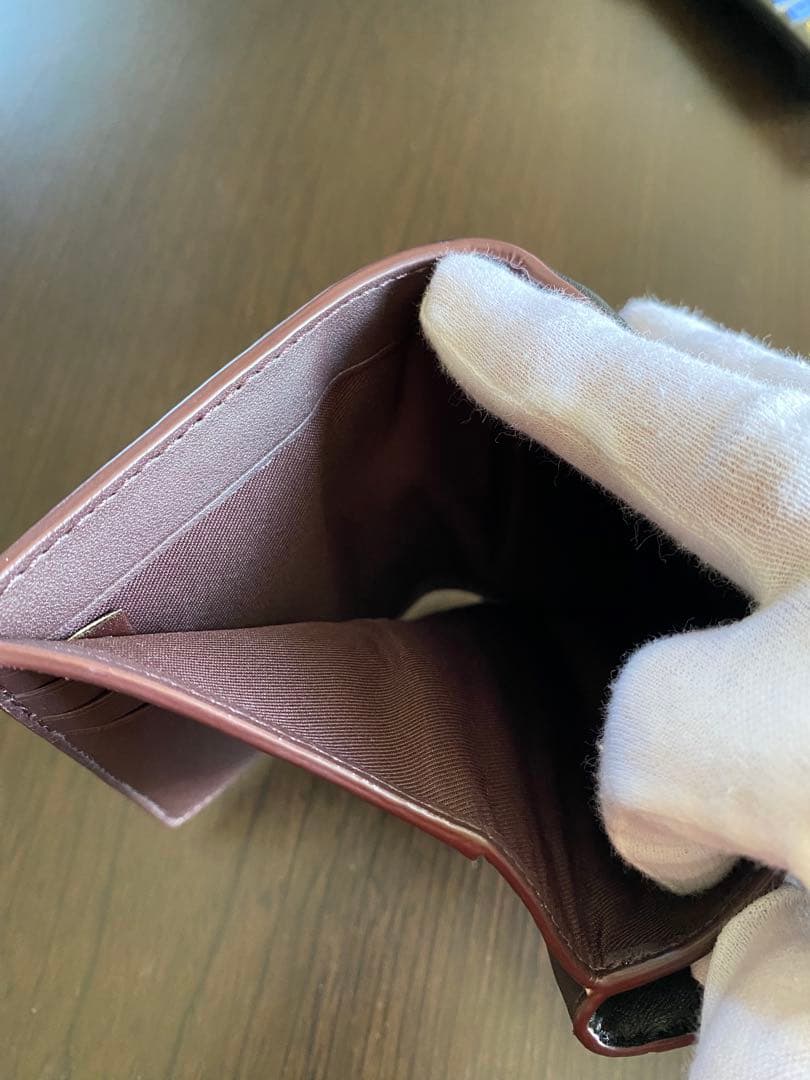 COACH エンボス加工 ブラック 二つ折り財布