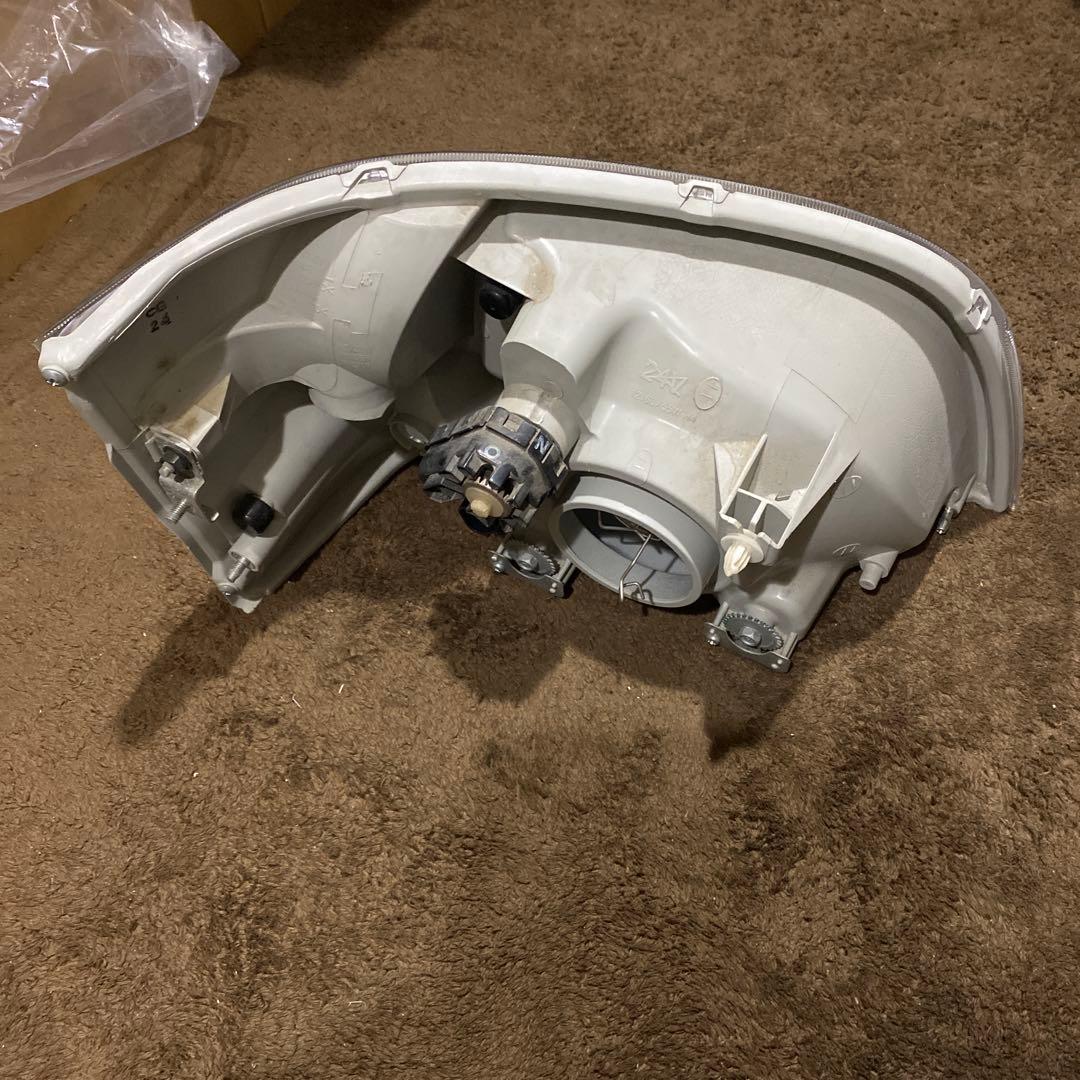ハイゼットトラック　EBD-S211Pヘッドライト左