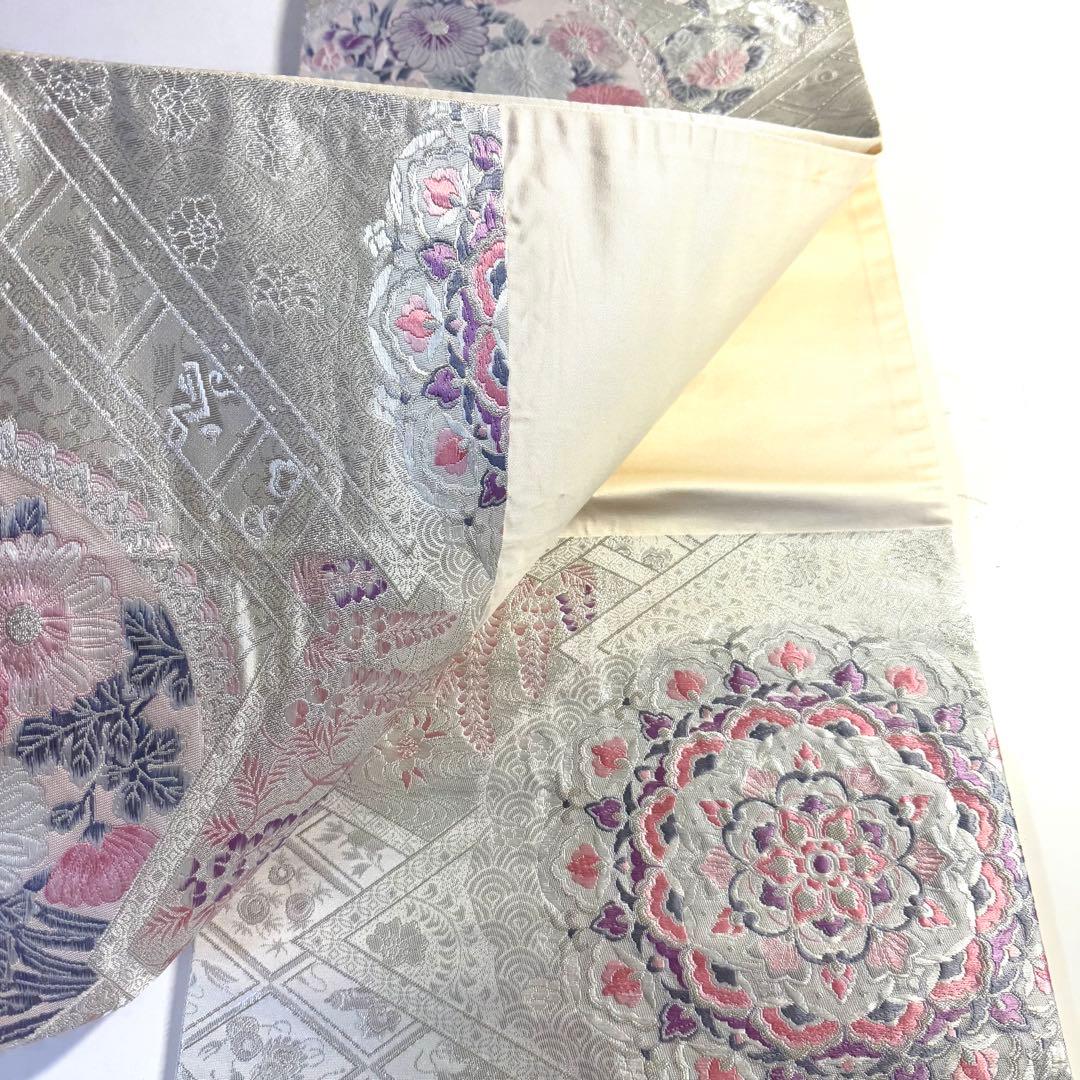 5k2780 袋帯　絹　唐織　プラチナ箔　正倉院文様　華文　銀色　白　ピンク　紫