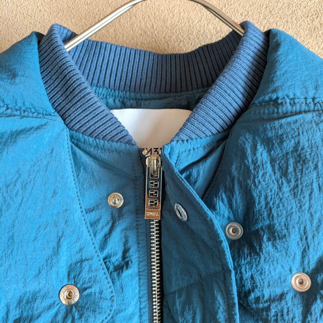 UN3D. ターコイズ 青 キルティングダウンベスト Wジッパー フード付