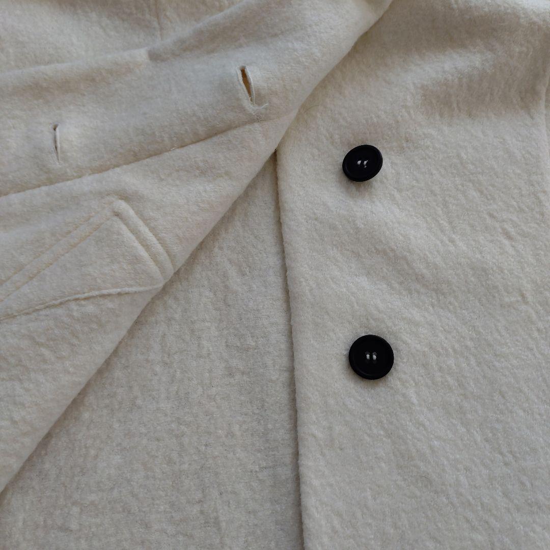 センソユニコ　モユル ホワイト ボタン付き ハイネック ポンチョ