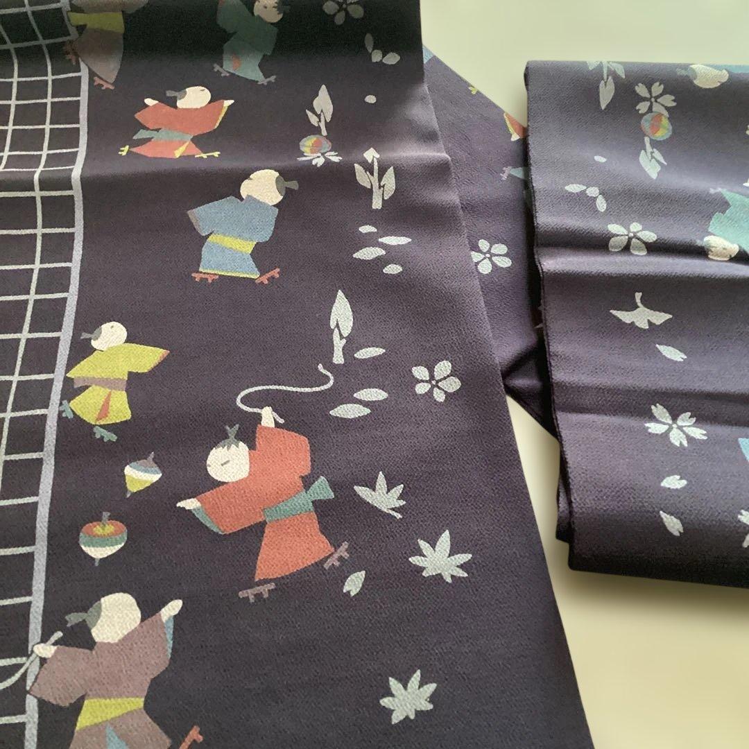 ほぼ未使用品　九寸名古屋帯 全通　正絹縮緬地　濃紫　遊ぶ童子柄　ガード加工済