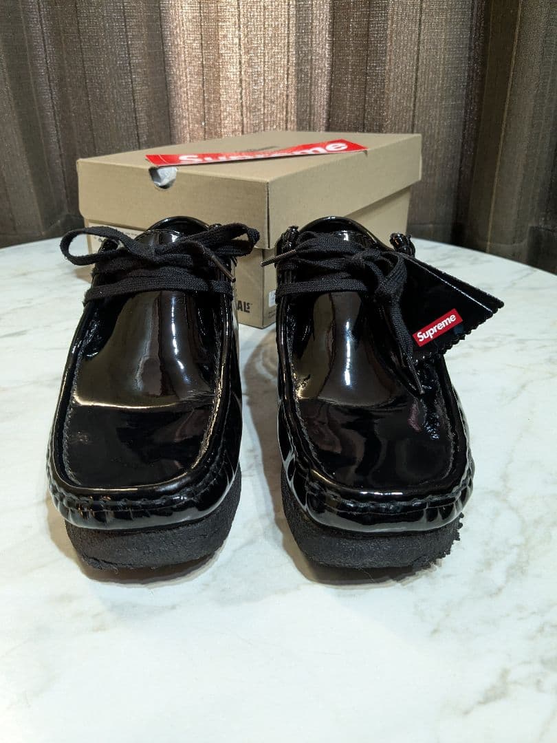 Supreme × Clarks patent leather wallabee