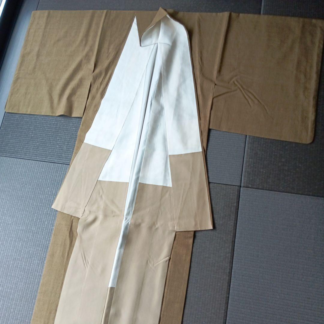 結城紬（との事で購入しております）色無地　紬　鶯茶色　梅幸茶　刺繍一つ紋入り