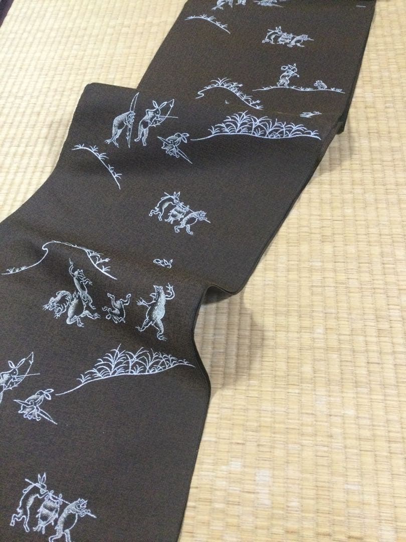 素敵な装い！西陣名古屋帯 綿芯仕立付 「鳥獣人物戯画」茶　簡易包装