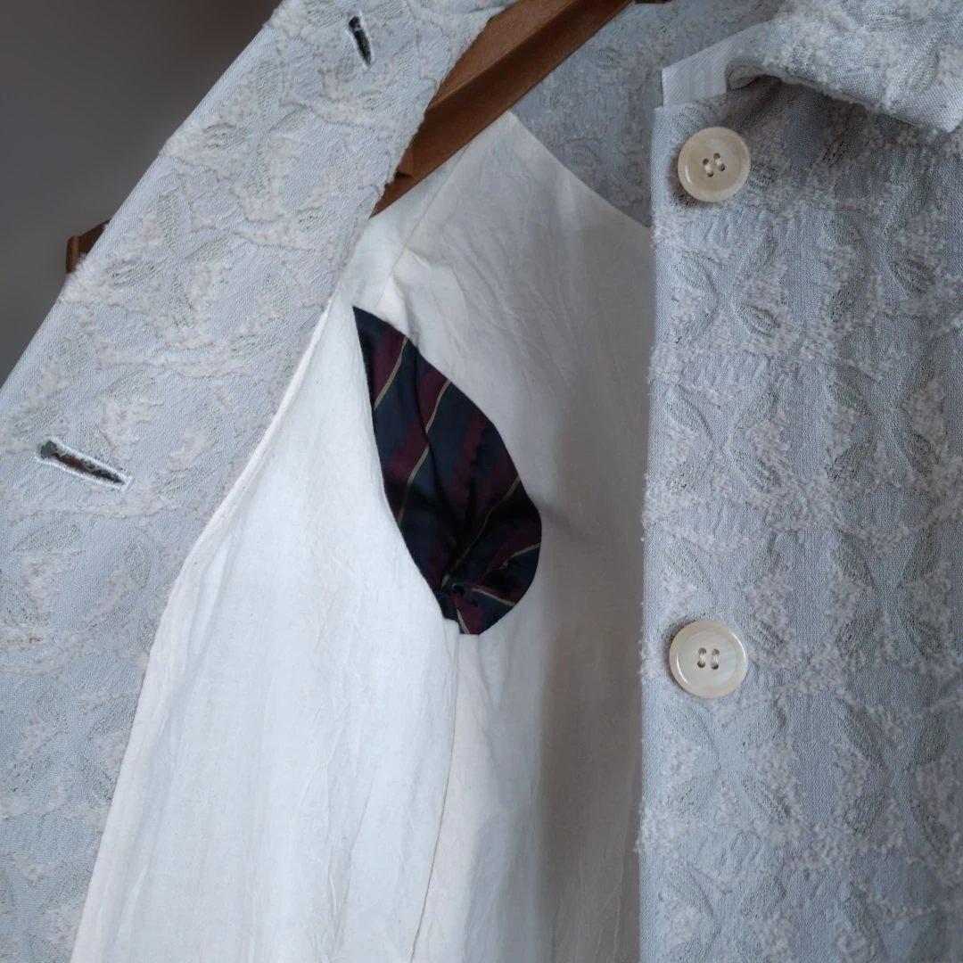 nooyボタン付きライトグレーコート