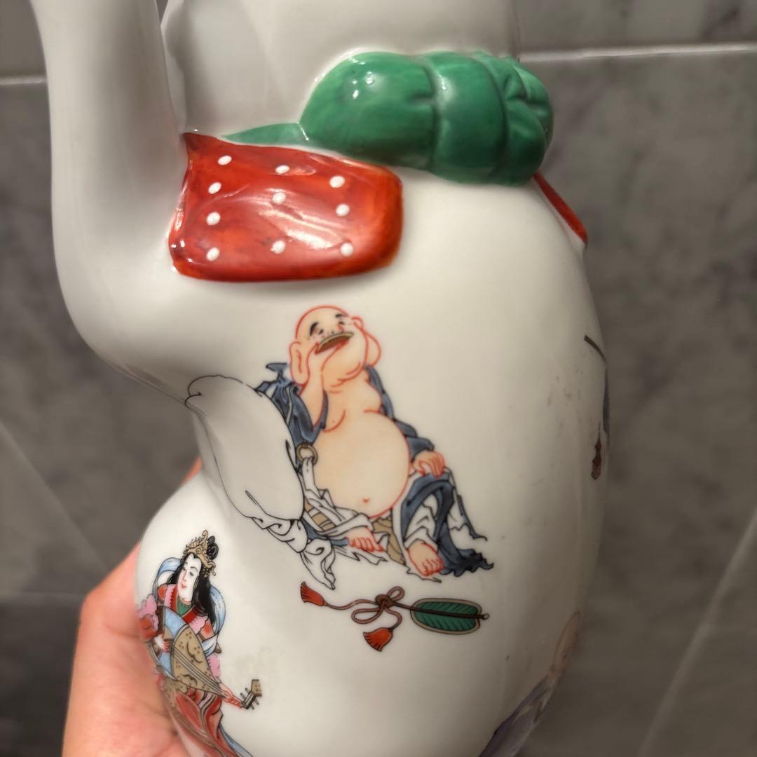 ヴィンテージ縁起の良い七福神が描かれ、可愛らしい瞳の招き猫