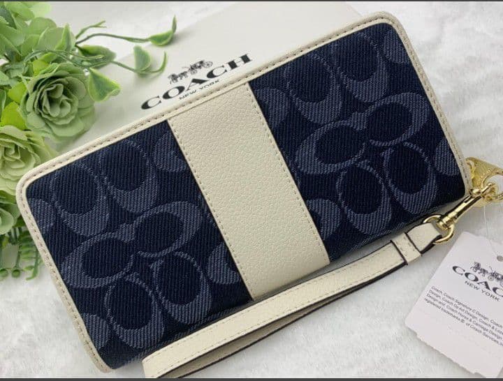 新品未使用コーチ長財布ネイビーホワイトシグネチャーレディースメンズ送料無料