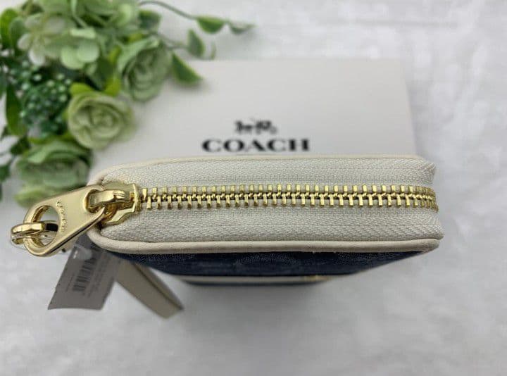 新品未使用コーチ長財布ネイビーホワイトシグネチャーレディースメンズ送料無料