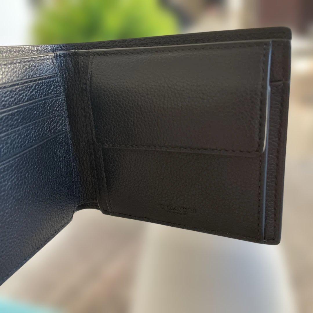 未使用　定価49,500円　COACH ブラック 二つ折り財布 ポケット付
