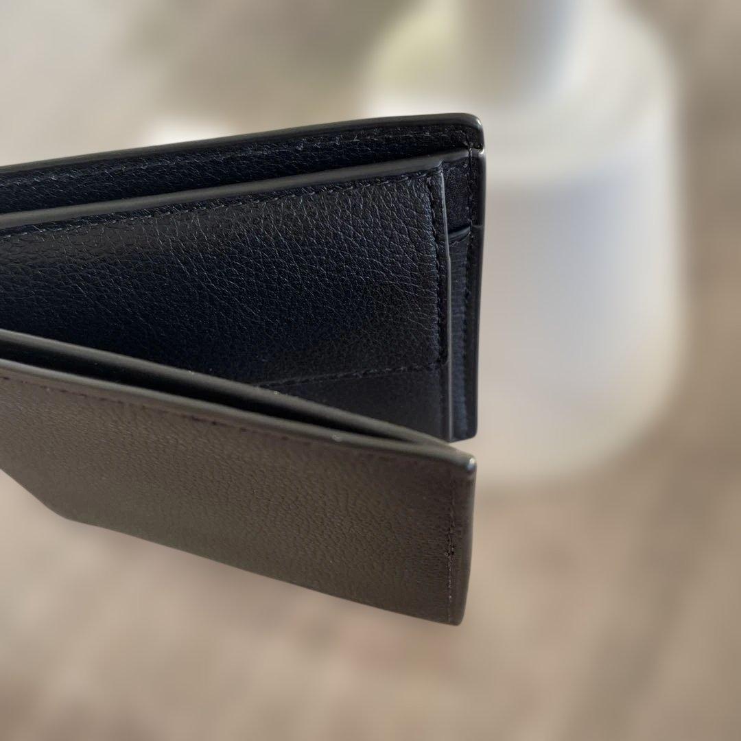 未使用　定価49,500円　COACH ブラック 二つ折り財布 ポケット付