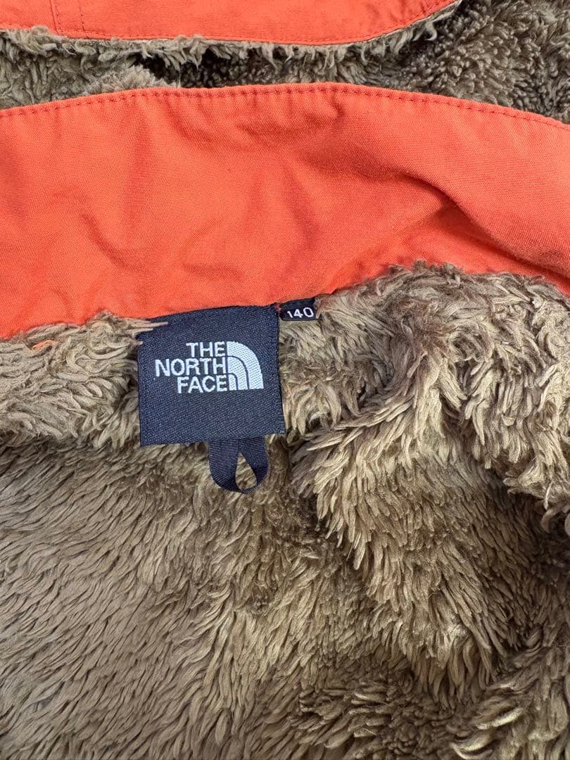 The North Face オレンジ コンパクトノマドジャケット