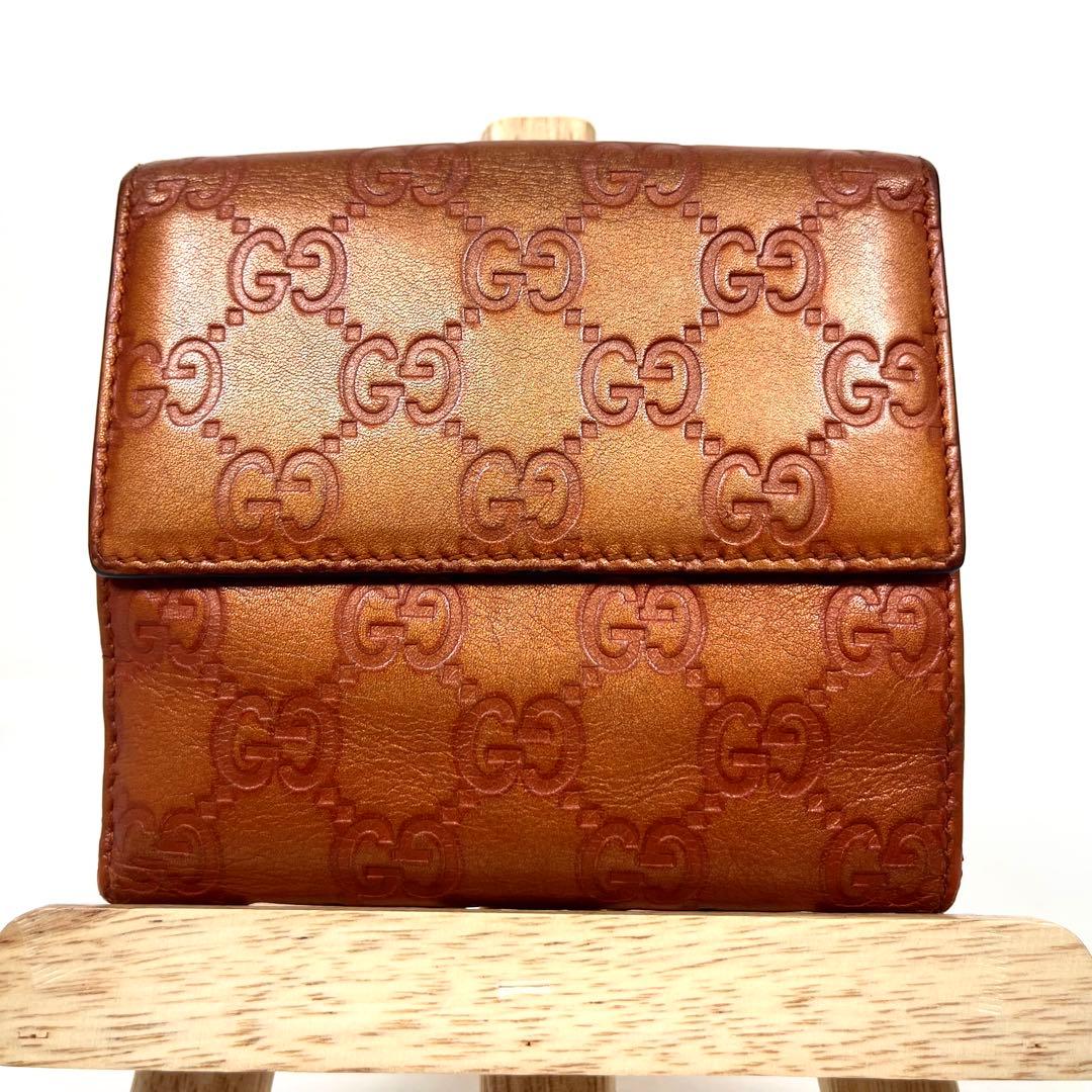 グッチ　二つ折り財布　ハートロゴプレート　GGシマレザー　型押しエンボス　美品
