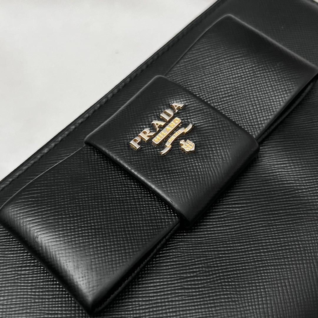 ◇美品◇プラダ　サフィアーノレザー長財布　ロゴ金具　リボンデザイン　ブラック