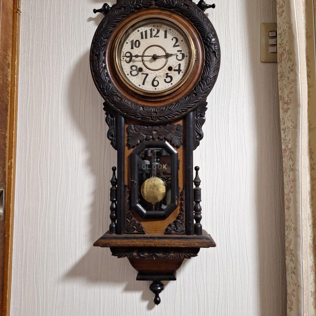 324 彫刻入り振り子掛時計　小型ひまわり柱時計