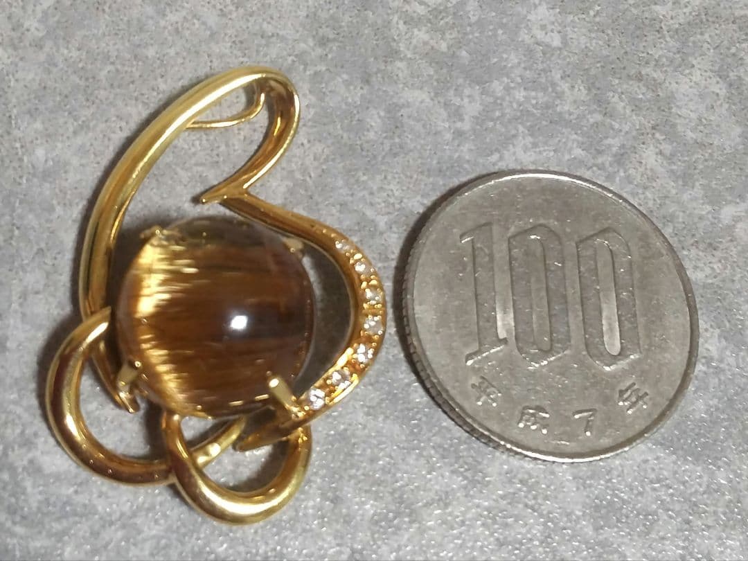 14.50ブラウンルチルキャッツアイダイヤ0.07入りk18ペンダントトップ