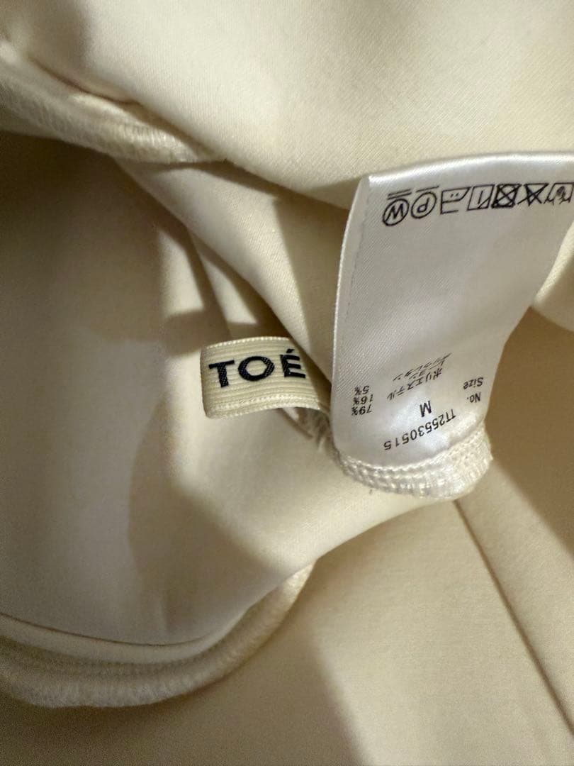 the toe ホワイト フリル付きパーカー