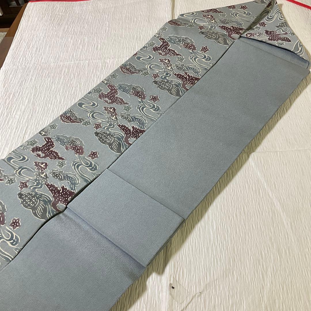 名古屋帯　縮緬　型染め　うすずみ色系　垂れ無地　亀　鶴？　流水　花