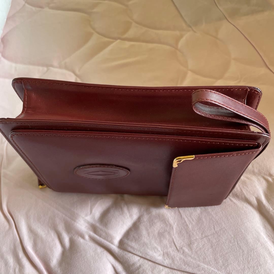 未使用　極美品　カルティエCartier ハンドバッグ　クラッチバッグ　エンジ色
