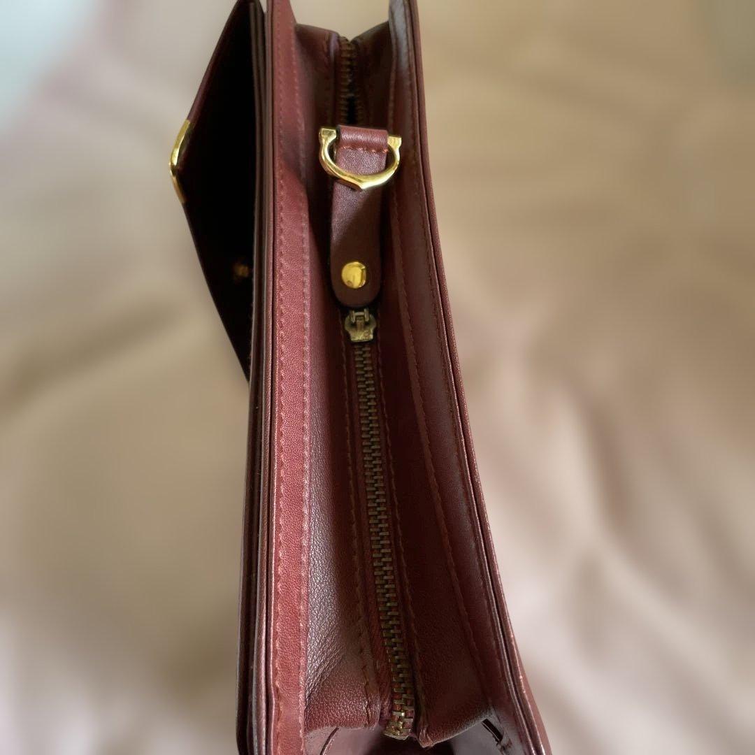 未使用　極美品　カルティエCartier ハンドバッグ　クラッチバッグ　エンジ色