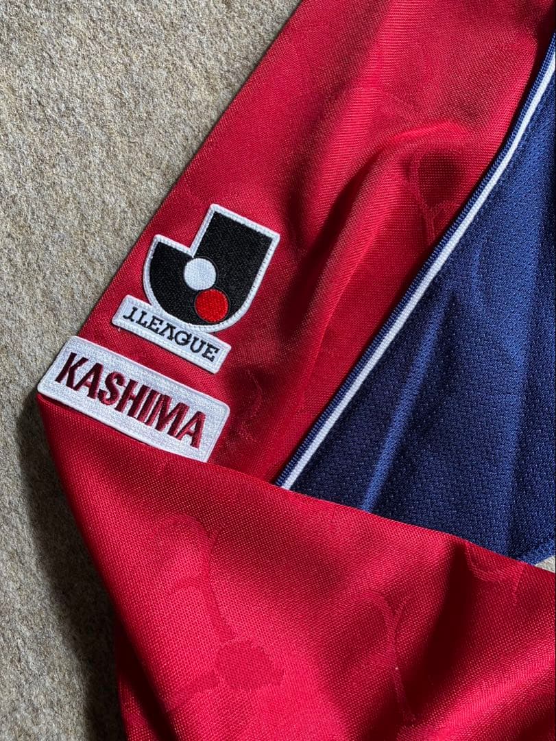 鹿島アントラーズ　ユニホームオレンジタグ　ベベットモデル