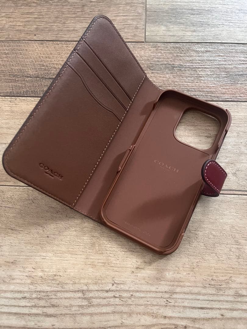 新品　COACH iPhone14pro 用　手帳型 シグネチャー　コーチ