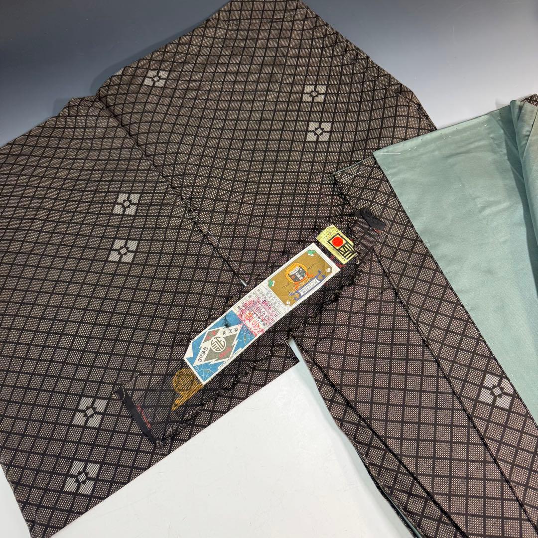 【未使用】本場奄美大島紬 純泥染 泥大島紬着物 しつけ糸付 証紙付き