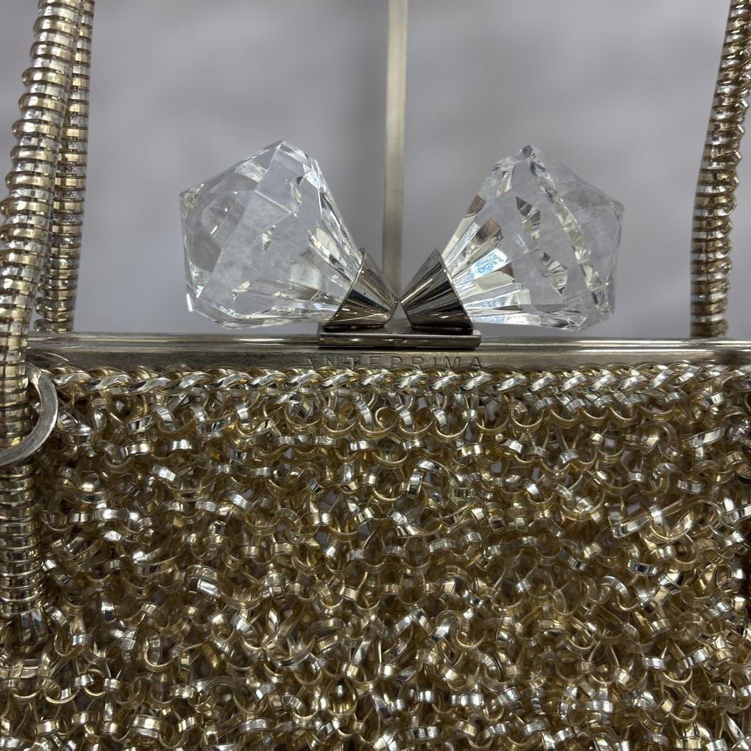 アンテプリマ　ワイヤーハンドバッグ　がま口　リボン　ゴールド