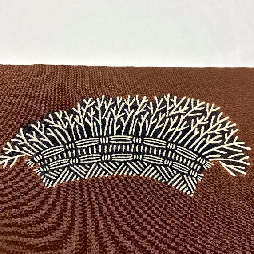 開き名古屋帯【栗山吉三郎】和染紅型 縮緬 垣根文様 茶色 お太鼓柄 正絹 九寸帯