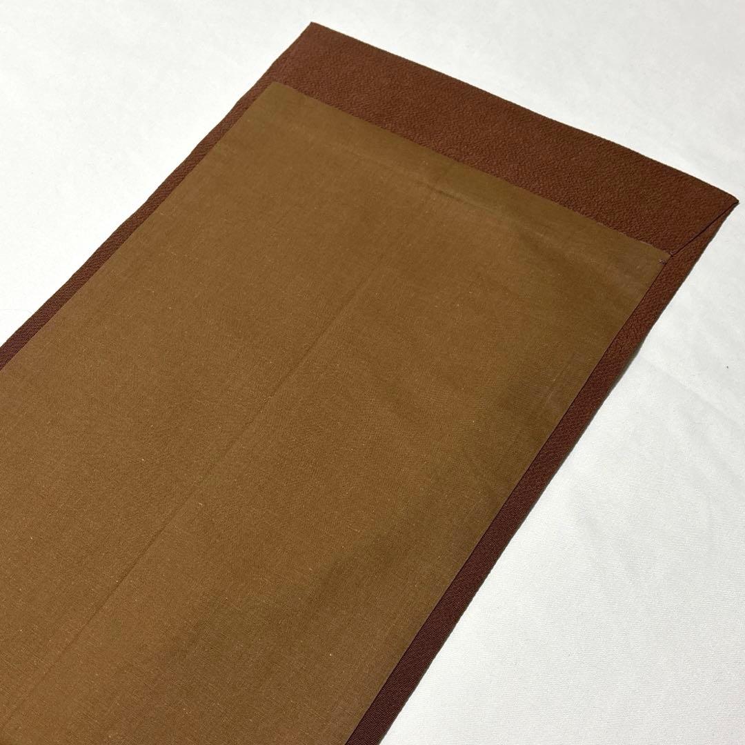 開き名古屋帯【栗山吉三郎】和染紅型 縮緬 垣根文様 茶色 お太鼓柄 正絹 九寸帯