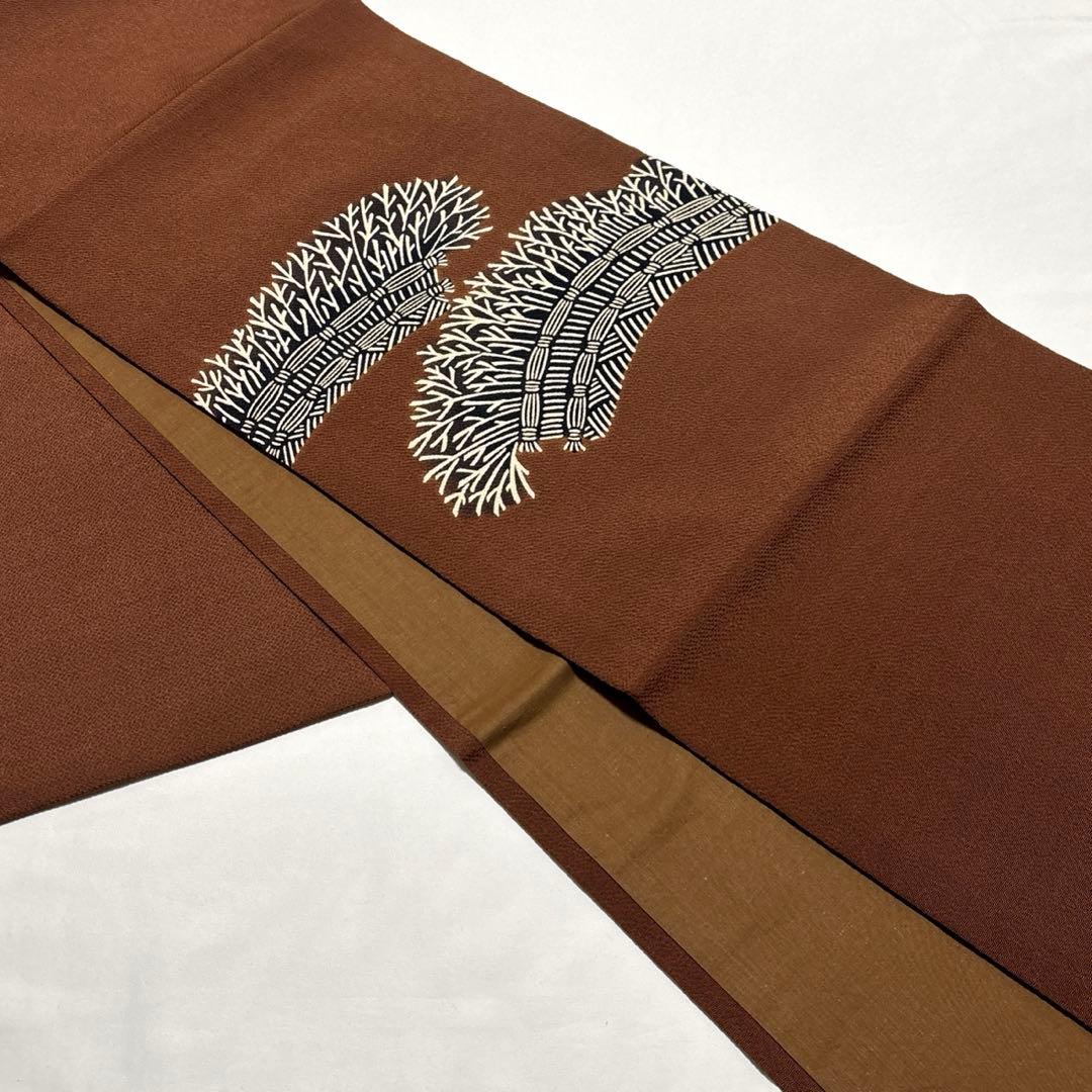 開き名古屋帯【栗山吉三郎】和染紅型 縮緬 垣根文様 茶色 お太鼓柄 正絹 九寸帯