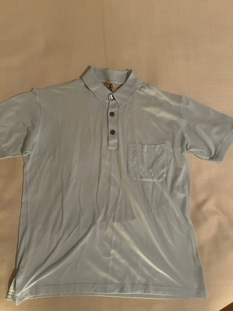 エルメス　ライトブルー　ポロシャツ　Hロゴ