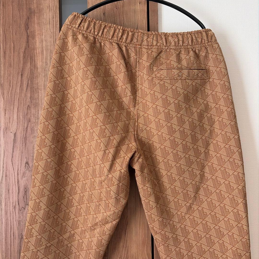 ラコステモノグラムトラックパンツ