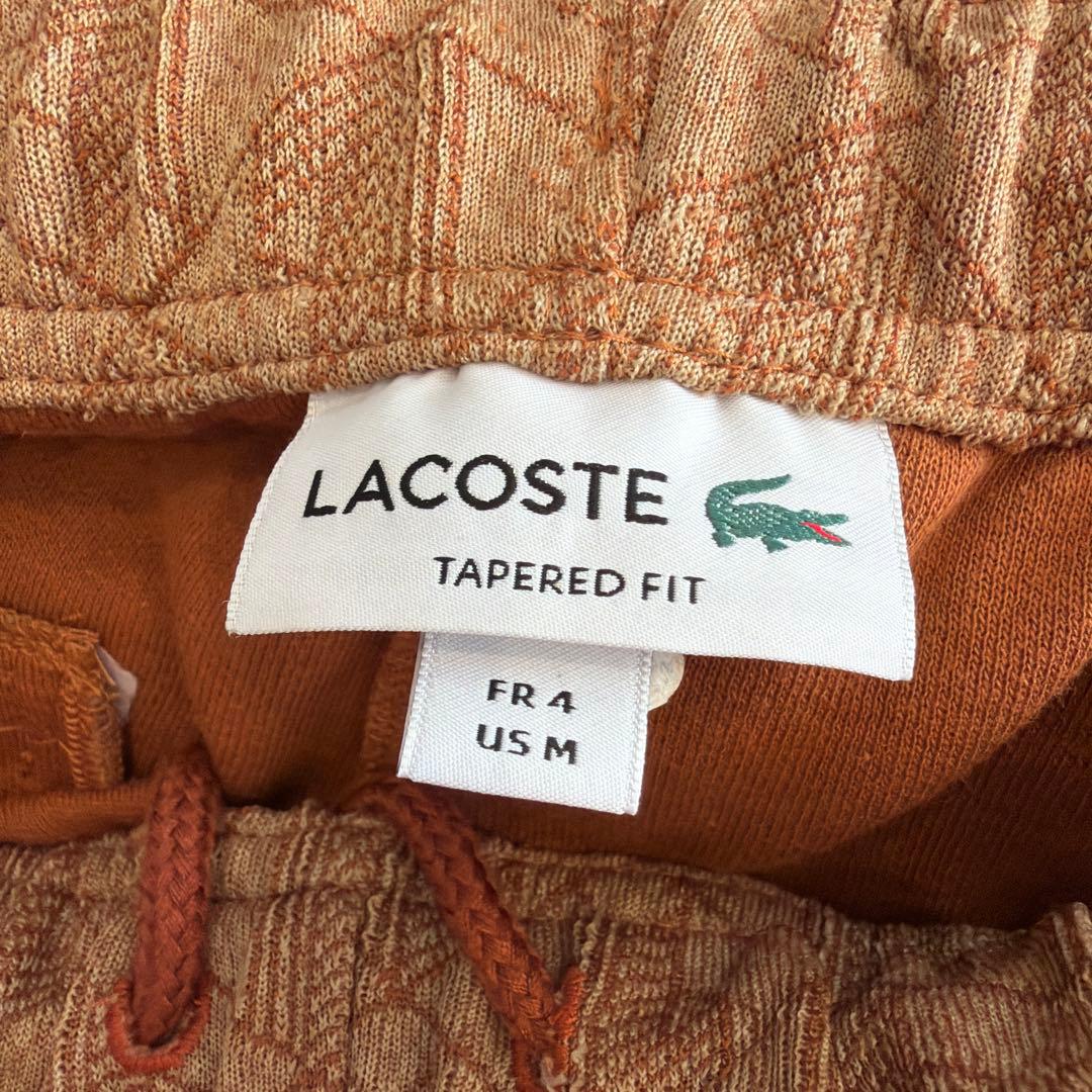 ラコステモノグラムトラックパンツ