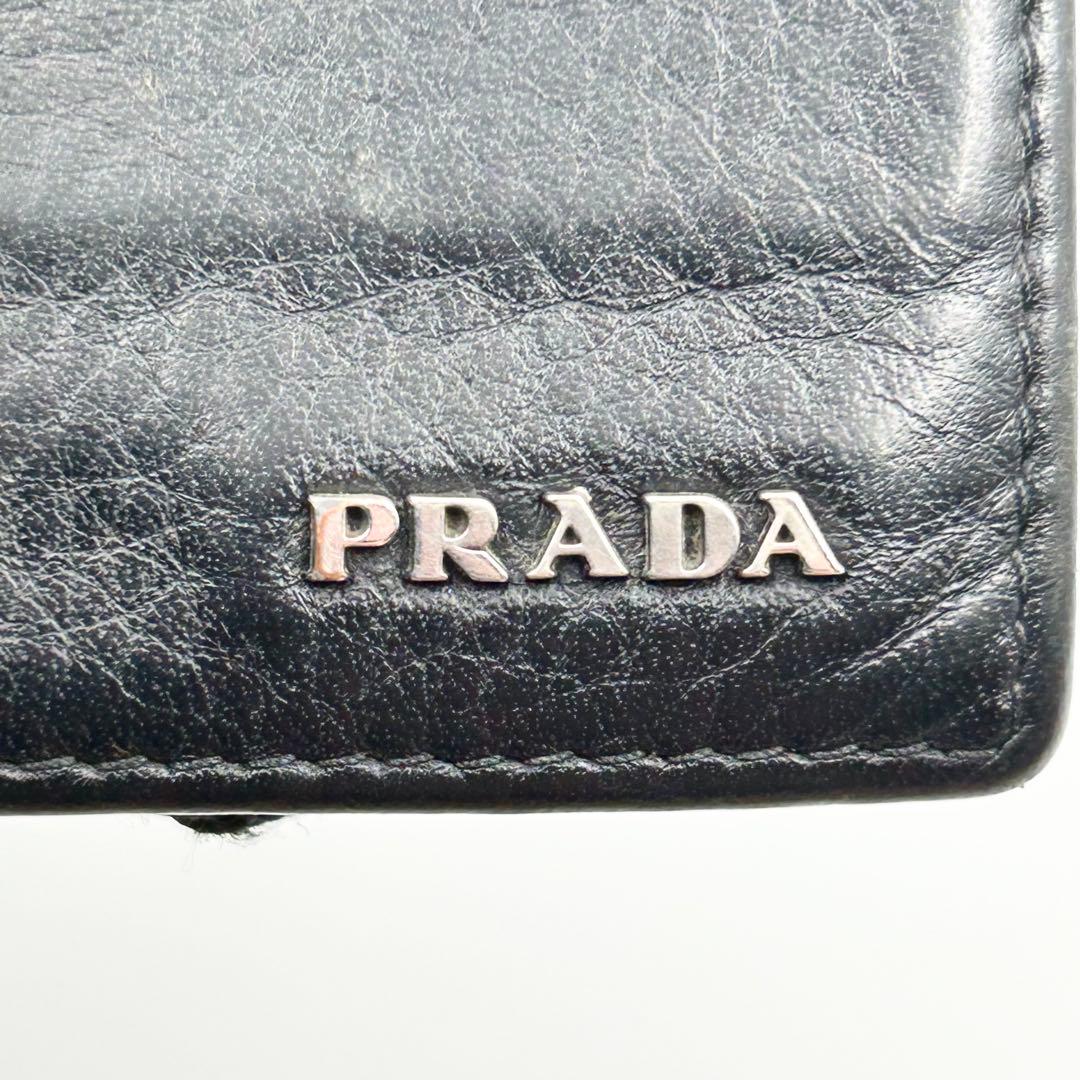 PRADA マネークリップ 折り財布 二つ折り ロゴ シルバー金具 シボ革 黒